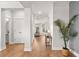 Hallway featuring hardwood floors, white walls, a modern light fixture and a peek at the cozy living room at 361 Ripple Park Dr, Summerville, SC 29486