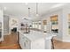 Bright, open kitchen with island seating flows into the adjacent living area at 361 Ripple Park Dr, Summerville, SC 29486