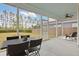 Relax on this screened-in porch with room for dining and appreciate the backyard views at 361 Ripple Park Dr, Summerville, SC 29486