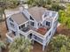 Stunning aerial view of a coastal property with multiple decks and scenic surroundings at 3635 Pompano Ct, Seabrook Island, SC 29455