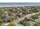 An aerial view of a coastal home with mature landscaping, near the beach at 3635 Pompano Ct, Seabrook Island, SC 29455