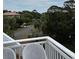Charming balcony provides a tranquil setting with seating and views of the surrounding landscape at 3635 Pompano Ct, Seabrook Island, SC 29455