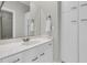 Bathroom features a white vanity with modern fixtures, a large mirror, and built-in storage cabinets at 3635 Pompano Ct, Seabrook Island, SC 29455