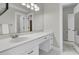 Bathroom featuring a white vanity, a large mirror with modern vanity lights, and tile flooring at 3635 Pompano Ct, Seabrook Island, SC 29455