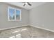 Simple bedroom featuring gray ceramic tile floors, neutral paint, a ceiling fan, and a window with blinds at 3635 Pompano Ct, Seabrook Island, SC 29455