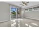Bedroom features ceramic tile floors, a ceiling fan, and access to a private balcony through a sliding glass door at 3635 Pompano Ct, Seabrook Island, SC 29455