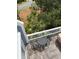 Elevated deck with an outdoor seating area, offering serene views of the lush landscaping below at 3635 Pompano Ct, Seabrook Island, SC 29455