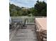 Inviting deck area with a table, chairs, and hot tub perfect for relaxation and enjoying the scenic views at 3635 Pompano Ct, Seabrook Island, SC 29455
