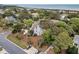 Charming coastal home featuring a stone driveway, mature landscaping, and a wooded path at 3635 Pompano Ct, Seabrook Island, SC 29455