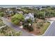 Lovely coastal home with mature landscaping including palm trees and an asphalt drive at 3635 Pompano Ct, Seabrook Island, SC 29455