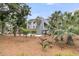 Attractive home featuring tropical landscaping and a charming white outdoor deck at 3635 Pompano Ct, Seabrook Island, SC 29455