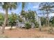 Stunning home featuring tropical landscaping and a charming white outdoor deck at 3635 Pompano Ct, Seabrook Island, SC 29455