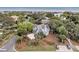 This aerial view shows a home with a long driveway with professional landscaping at 3635 Pompano Ct, Seabrook Island, SC 29455