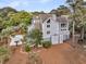 Beautiful multi-story home with a lush, landscaped yard, offering a serene and inviting curb appeal at 3635 Pompano Ct, Seabrook Island, SC 29455