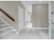 Entryway featuring marble flooring, a wooden banister and staircase leading upstairs at 3635 Pompano Ct, Seabrook Island, SC 29455