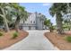 This home features a long drive way and mature palm trees at 3635 Pompano Ct, Seabrook Island, SC 29455