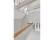 Hallway features a wood banister, pendant lighting, and large windows at 3635 Pompano Ct, Seabrook Island, SC 29455