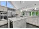 Modern kitchen features stainless steel appliances, marble counter tops, and large windows at 3635 Pompano Ct, Seabrook Island, SC 29455