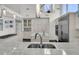 Modern kitchen features stainless steel appliances, custom cabinets, marble counters, and an island sink at 3635 Pompano Ct, Seabrook Island, SC 29455