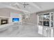Inviting living room featuring a fireplace, built-ins, and access to an outdoor patio at 3635 Pompano Ct, Seabrook Island, SC 29455