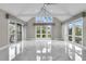 Open living room showcasing vaulted ceilings and lots of natural light at 3635 Pompano Ct, Seabrook Island, SC 29455