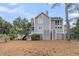 Rear view of this lovely two-story home featuring a beautiful back yard at 3635 Pompano Ct, Seabrook Island, SC 29455