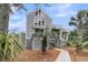 Rear view of this two-story home with multiple decks, offering great views at 3635 Pompano Ct, Seabrook Island, SC 29455