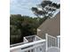 Upper rooftop deck boasting serene views of the neighborhood and tree-lined horizon at 3635 Pompano Ct, Seabrook Island, SC 29455