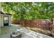 The backyard with a concrete patio surrounded by a wooden fence at 3802 Annapolis Way, Ladson, SC 29456