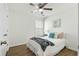 A cozy bedroom with ceiling fan, a window, and a comfortable bed with throw blanket at 3802 Annapolis Way, Ladson, SC 29456
