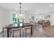 Dining room area with view of the backyard, open to living room with lots of natural light at 397 Parkdale Dr, Charleston, SC 29414