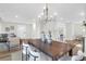 Open concept dining room with modern chandelier, seating for six, and natural light at 397 Parkdale Dr, Charleston, SC 29414
