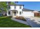 Charming two-story home with a manicured lawn, a modern door and an attached garage at 397 Parkdale Dr, Charleston, SC 29414