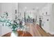 Bright kitchen features white cabinets, stainless steel appliances and hardwood floors at 397 Parkdale Dr, Charleston, SC 29414