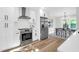 Modern kitchen featuring stainless steel appliances, white cabinetry and hardwood floors at 397 Parkdale Dr, Charleston, SC 29414