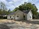 The covered back patio offers a perfect space for outdoor living, overlooking a spacious yard at 419 Ravenwood Rd, Walterboro, SC 29488