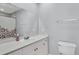 Bathroom with white cabinets, a large mirror, and a shower with a floral curtain at 4807 Habersham Ln, Summerville, SC 29485