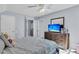 Inviting bedroom featuring a bed, ceiling fan, and a dresser with a TV at 4807 Habersham Ln, Summerville, SC 29485