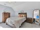 Comfortable bedroom with wooden furniture, sloped ceilings, and a full-sized bed at 4807 Habersham Ln, Summerville, SC 29485