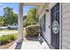Cozy front porch entrance with classic columns and welcoming decorations, creating a charming curb appeal at 4807 Habersham Ln, Summerville, SC 29485