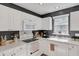 Functional kitchen equipped with modern appliances, white cabinetry, and ample counter space for food preparation at 4807 Habersham Ln, Summerville, SC 29485
