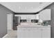 Well-lit kitchen featuring stainless steel appliances, white cabinets, and practical layout at 4807 Habersham Ln, Summerville, SC 29485