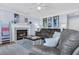 Comfortable living room featuring a fireplace, neutral paint colors, and plush seating for relaxation at 4807 Habersham Ln, Summerville, SC 29485