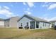 Large, flat backyard with a covered patio and outdoor grill, great for entertaining at 483 Pender Woods Dr, Summerville, SC 29486