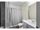Well-lit bathroom featuring white cabinets, granite countertops, and shower with a curtain at 483 Pender Woods Dr, Summerville, SC 29486