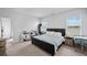 Bright bedroom featuring neutral walls, carpet, large bed, and ample natural light at 483 Pender Woods Dr, Summerville, SC 29486