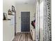 Inviting entryway with wood-look flooring, storage, and plenty of natural light at 483 Pender Woods Dr, Summerville, SC 29486