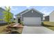 Charming single-story home with a two-car garage and manicured front yard at 483 Pender Woods Dr, Summerville, SC 29486