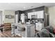 Modern kitchen with granite countertops, stainless steel appliances, and a stylish center island at 483 Pender Woods Dr, Summerville, SC 29486