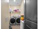Convenient laundry room with front load washer and dryer and ample shelving at 483 Pender Woods Dr, Summerville, SC 29486